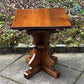 A RUPERT GRIFFITHS MONASTIC CARVED SOLID OAK LAMP TABLE / PLANT STAND