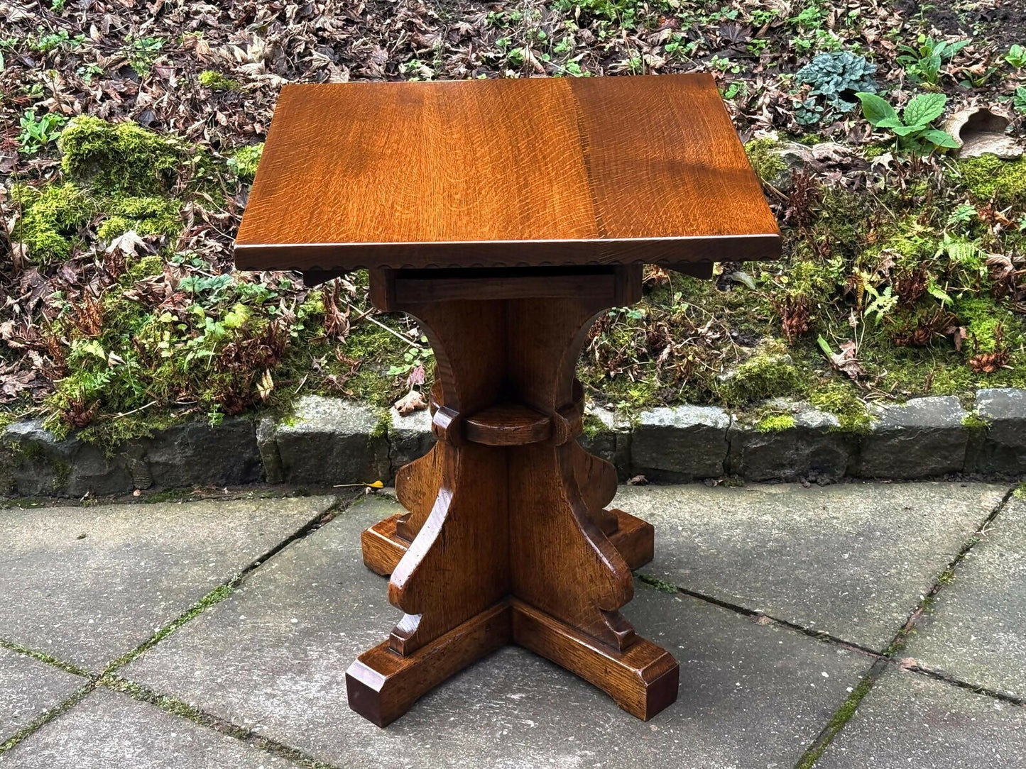 A RUPERT GRIFFITHS MONASTIC CARVED SOLID OAK LAMP TABLE / PLANT STAND