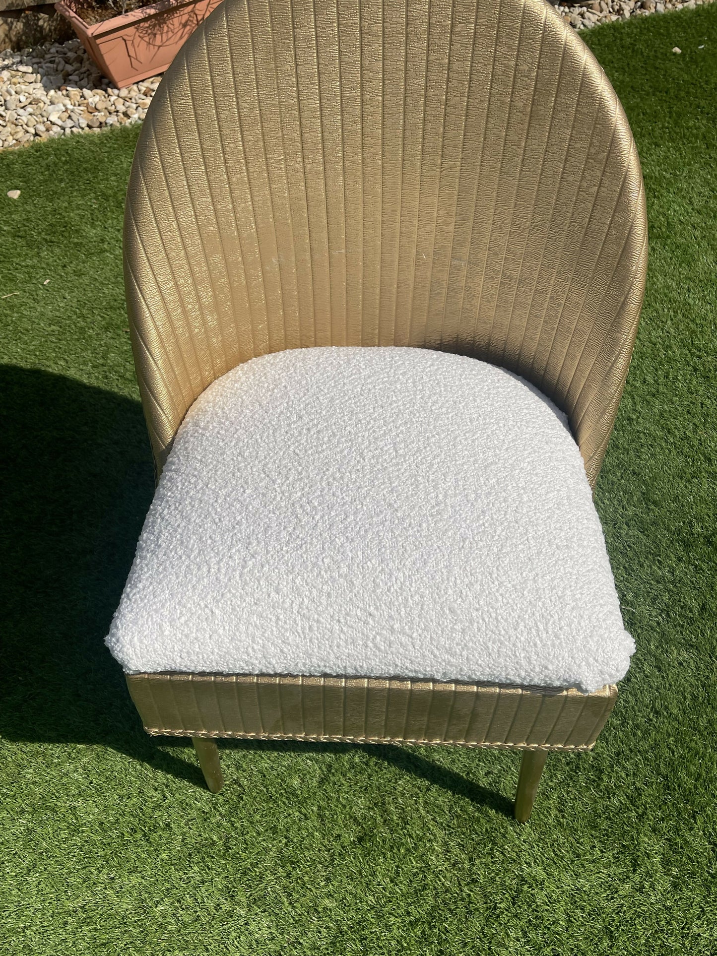 Gold wipe clean accent chair with luxurious white boucle fabric and some sneaky storage