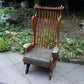 A RUPERT / NIGEL GRIFFITHS CARVED OAK DERBYSHIRE WING BACK LEATHER / ARMCHAIR