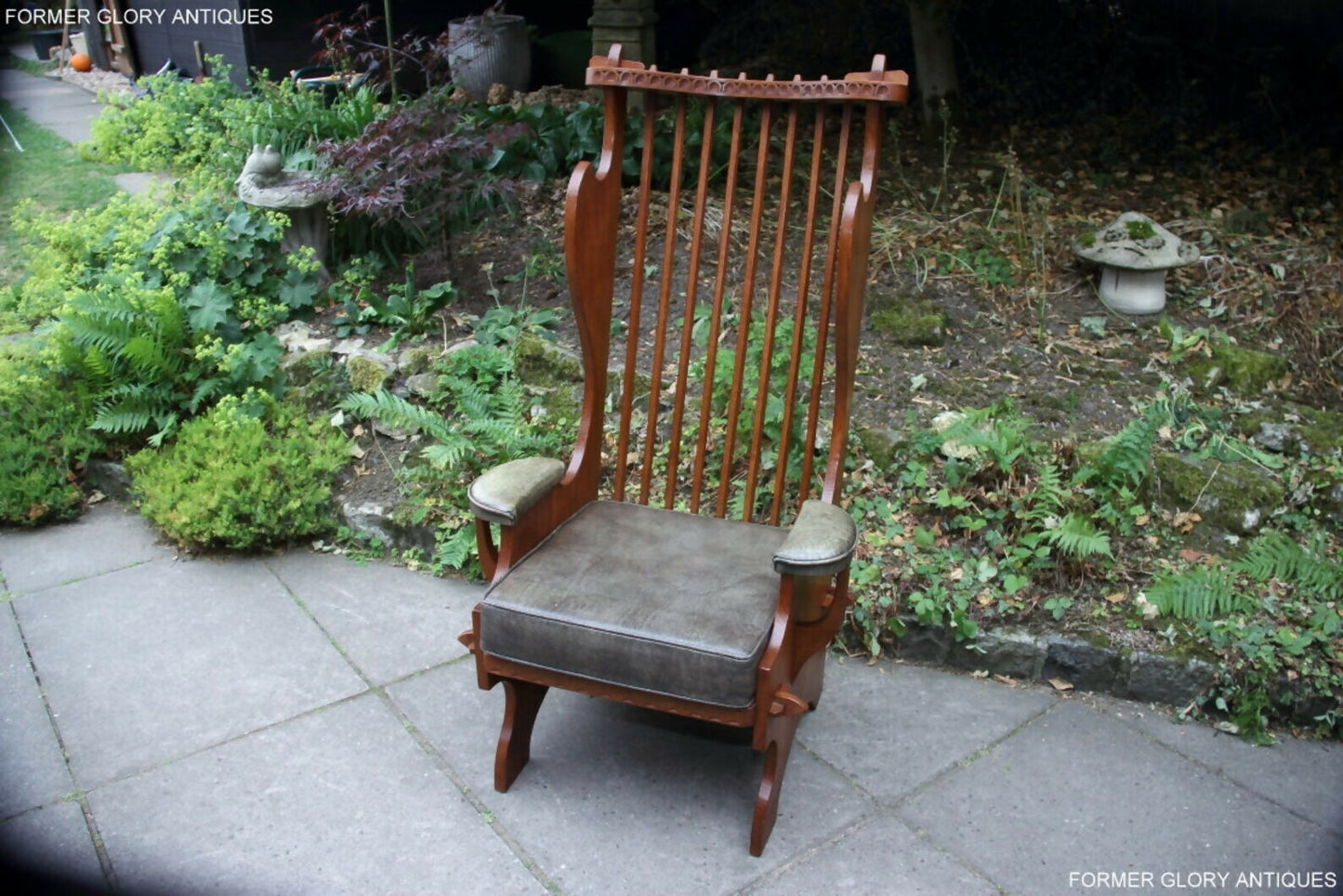 A RUPERT / NIGEL GRIFFITHS CARVED OAK DERBYSHIRE WING BACK LEATHER / ARMCHAIR