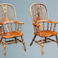 A Large Pair of Ash Broad Arm Windsor Chairs