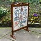 A RUPERT / NIGEL GRIFFITHS MONASTIC CARVED OAK FIRE SCREEN / STAND