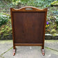 A RUPERT / NIGEL GRIFFITHS MONASTIC CARVED OAK FIRE SCREEN / STAND
