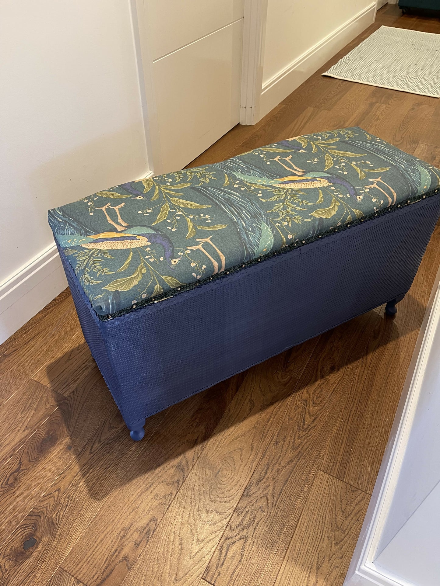 Peacock themed ottoman. Mid century refurbished