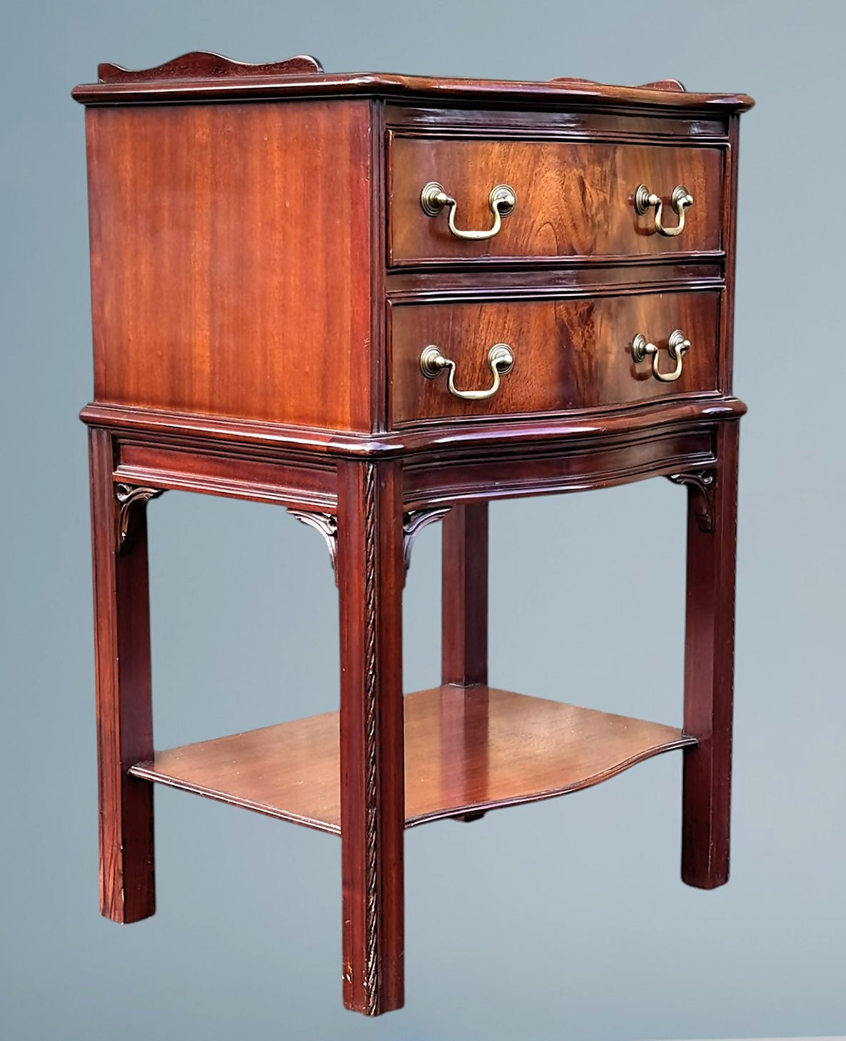 A Figured Mahogany Serpentine Chest of Drawers / Bedside Chest