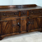A NIGEL RUPERT GRIFFITHS MONASTIC CARVED OAK DRESSER BASE / SIDEBOARD / CABINET / CUPBOARD.