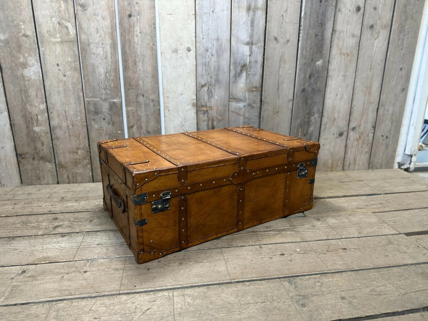 luxury tan leather coffee table trunk.