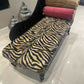 Baby chaise lounge in velvet zebra print and faux mink fur roll top