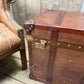 Antique leather trimmed chestnut brown campaign chest