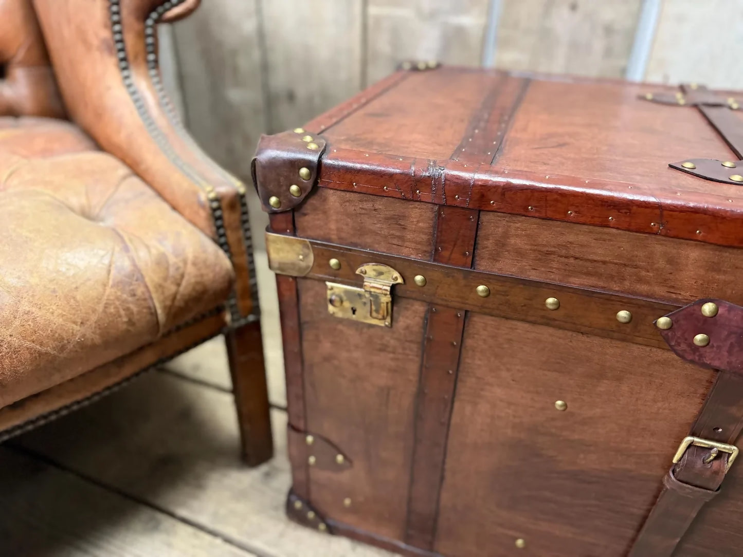 Antique leather trimmed chestnut brown campaign chest