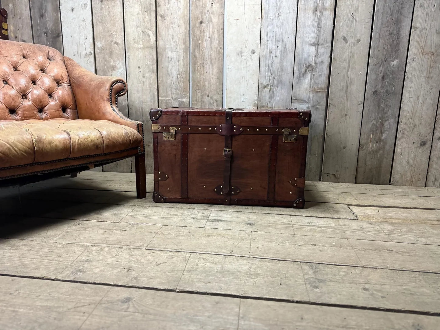 Antique leather trimmed chestnut brown campaign chest