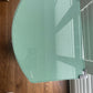 Occasional or bedside table. Green paint. Glass top.