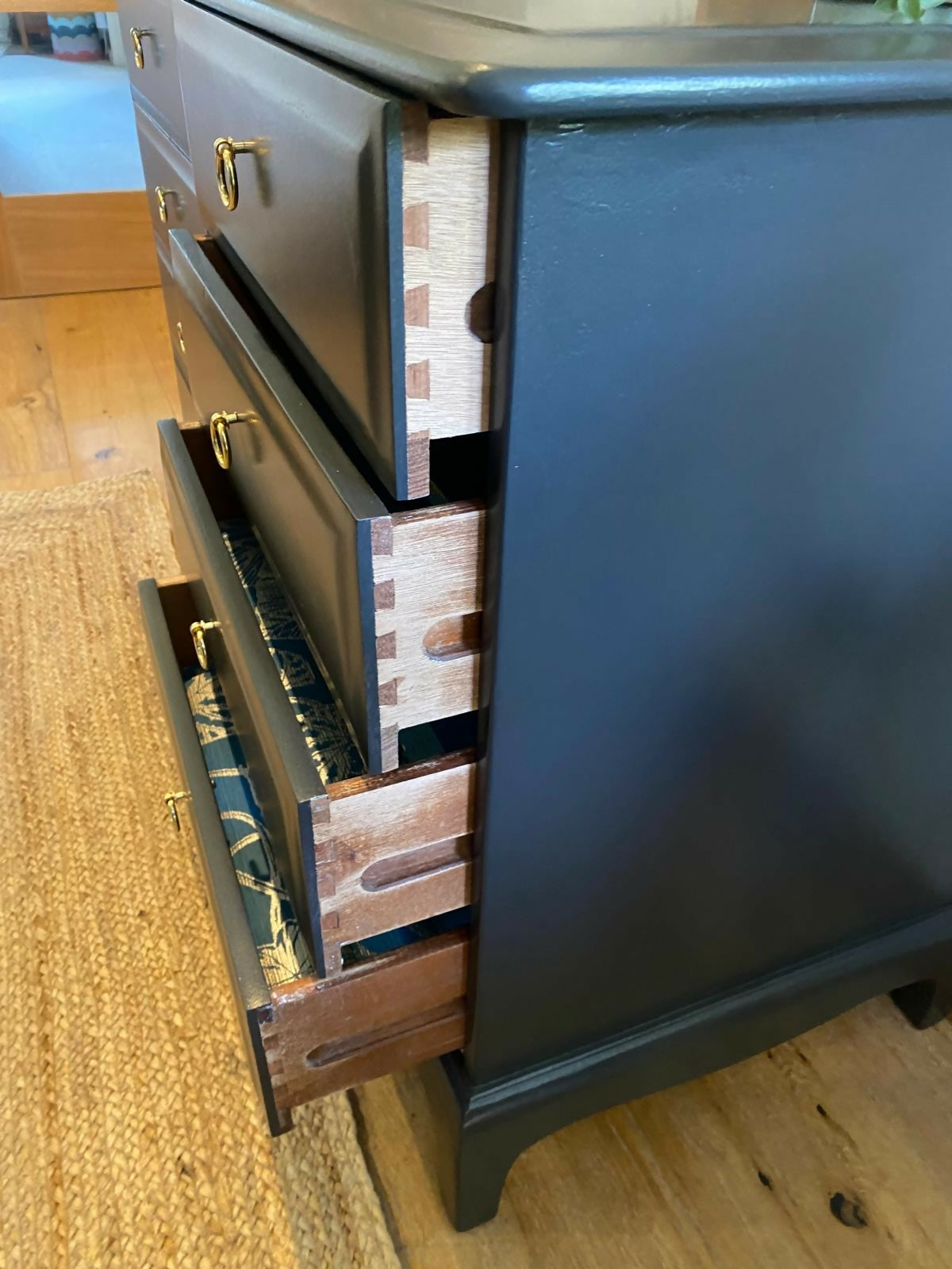 Stag four drawer black bedside cabinets, pair,