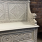 Edwardian antique Settle in solid oak with ornate carvings.
