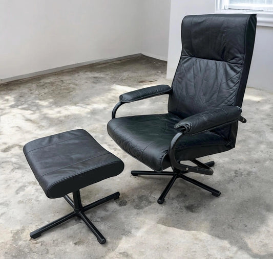 Black Mid century recliner swivel chair and stool in the manner of Kebe Mobler