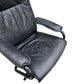 Black Mid century recliner swivel chair and stool in the manner of Kebe Mobler