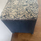 Mid century Ottoman. Repainted and reupholstered in Brer Rabbit material fabric dark blue