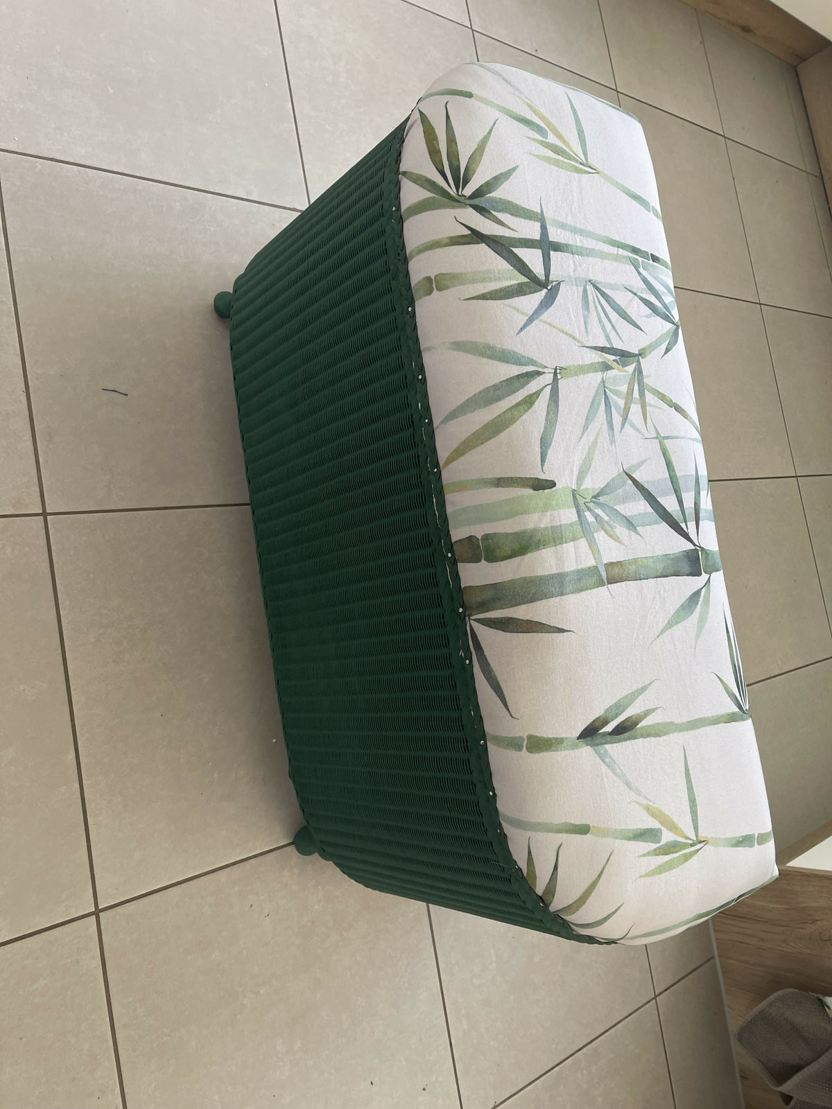 Lloyd loom ottoman. Matt Forest Green paint and matching bamboo motif fabric