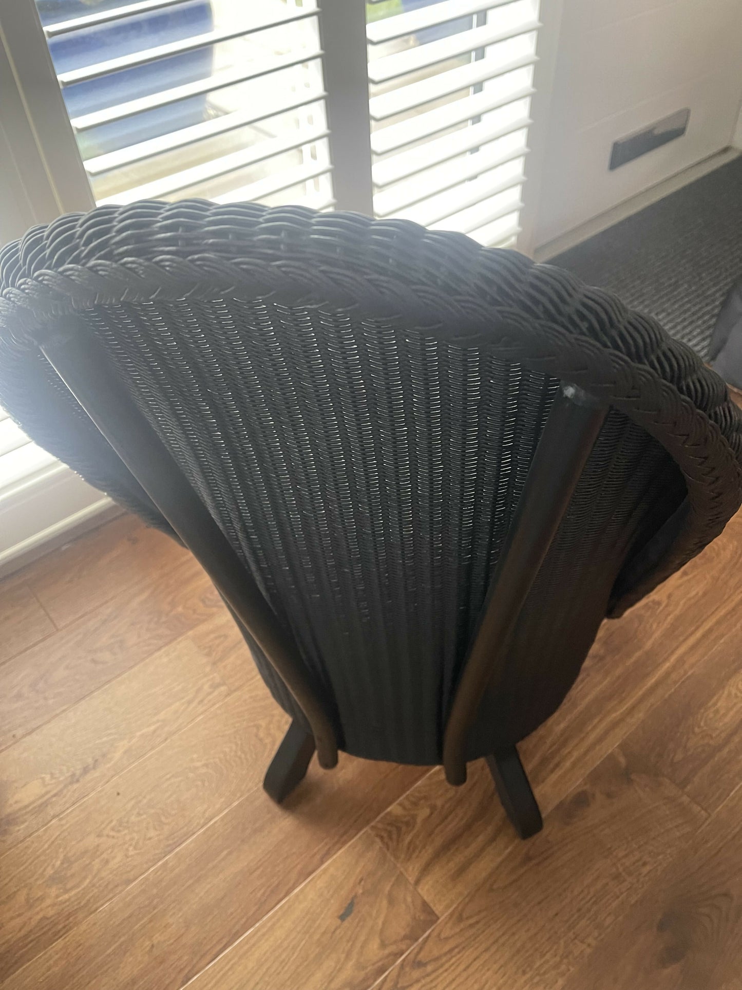 Lloyd loom low accent chair. Black satin paint and William morris style fabric