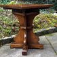 A RUPERT GRIFFITHS MONASTIC CARVED SOLID OAK LAMP TABLE / PLANT STAND