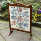 A RUPERT / NIGEL GRIFFITHS MONASTIC CARVED OAK FIRE SCREEN / STAND