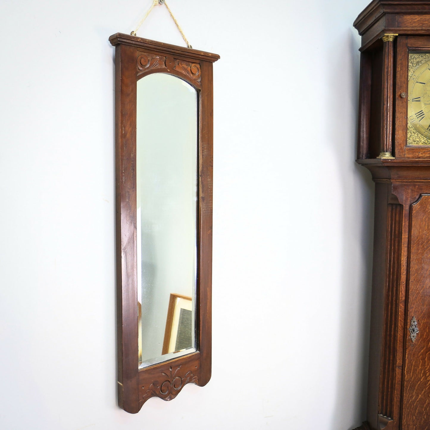 A Pair of Victorian Wall Mirrors Bevel Edged Glass Carved Top and Bottom
