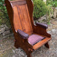 A NIGEL RUPERT GRIFFITHS MONASTIC CARVED OAK LEATHER FIRESIDE CHAIR / ARMCHAIR