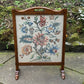 A RUPERT / NIGEL GRIFFITHS MONASTIC CARVED OAK FIRE SCREEN / STAND