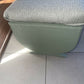 Small mid century Ottoman storage and seat. Sage green paint makes you choose the material.
