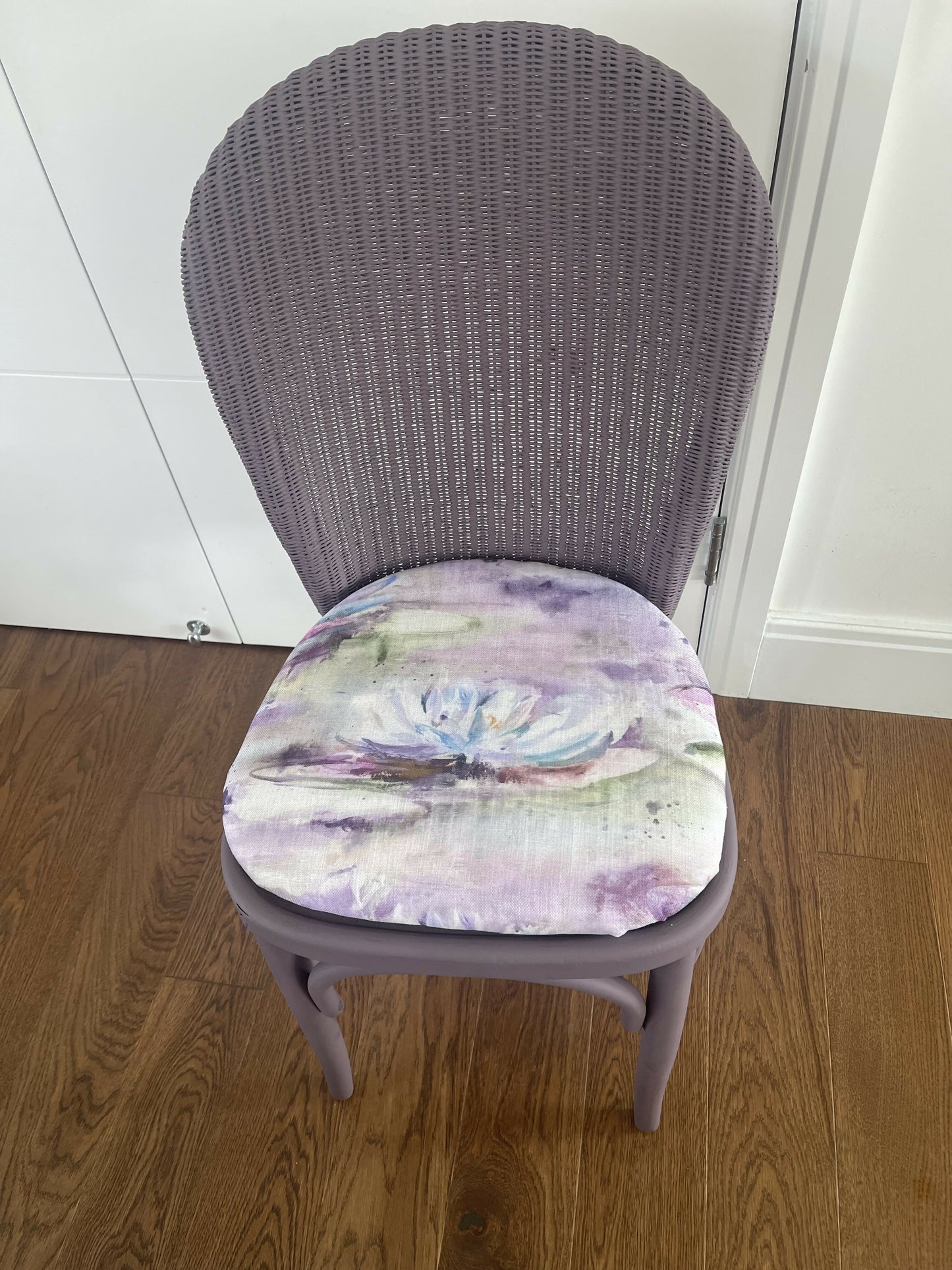Stylish Lloyd loom accent chair very Matt aubergine paint and matching cotton lily themed fabric