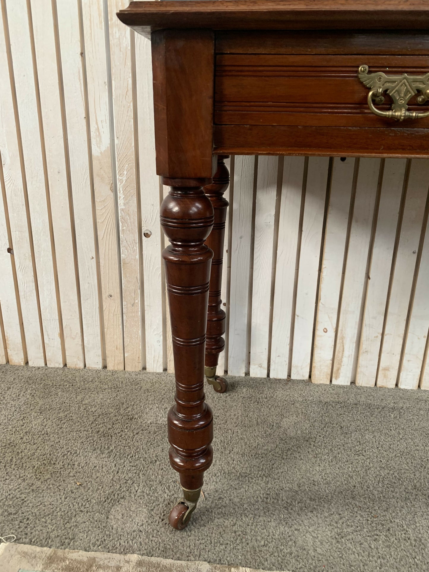 A Victorian Mahogany Writing Table/Desk With Drawer on castors.