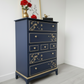 Nay and gold stag minstrel tall boy chest of drawers