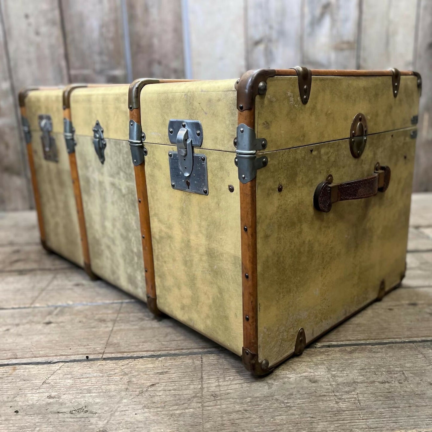 antique beige leather banded travel trunk with keys