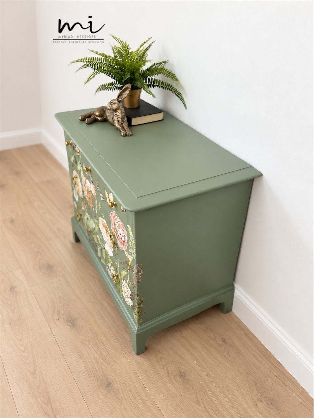 Sage green Stag Minstrel chest of drawers with neutral floral design. 3 over 2. Sideboard, dresser, bedside table