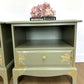 Stag Minstrel Bedside Tables In Pale Sage Green With Gold Foil Bird And Floral Design