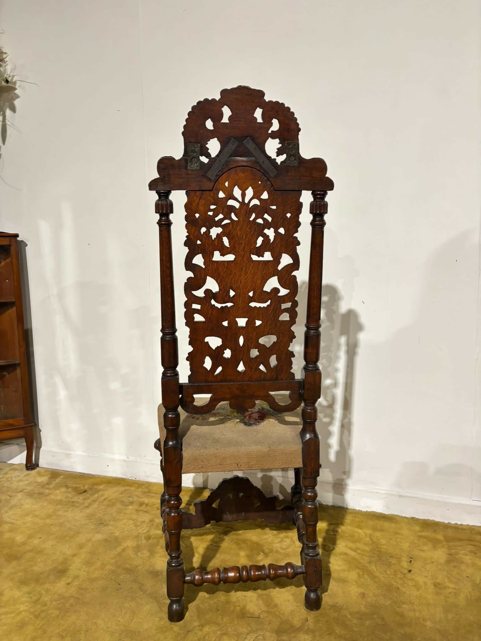 Carolean carved oak high back chair - having a very decoratively carved back, legs5