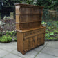A RUPERT / NIGEL GRIFFITHS MONASTIC CARVED OAK DERBYSHIRE DRESSER / SIDEBOARD.