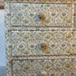 Antique chest of drawers covered in William Morris decoupage. With hand painted handles.