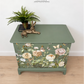 Sage green Stag Minstrel chest of drawers with neutral floral design. 3 over 2. Sideboard, dresser, bedside table