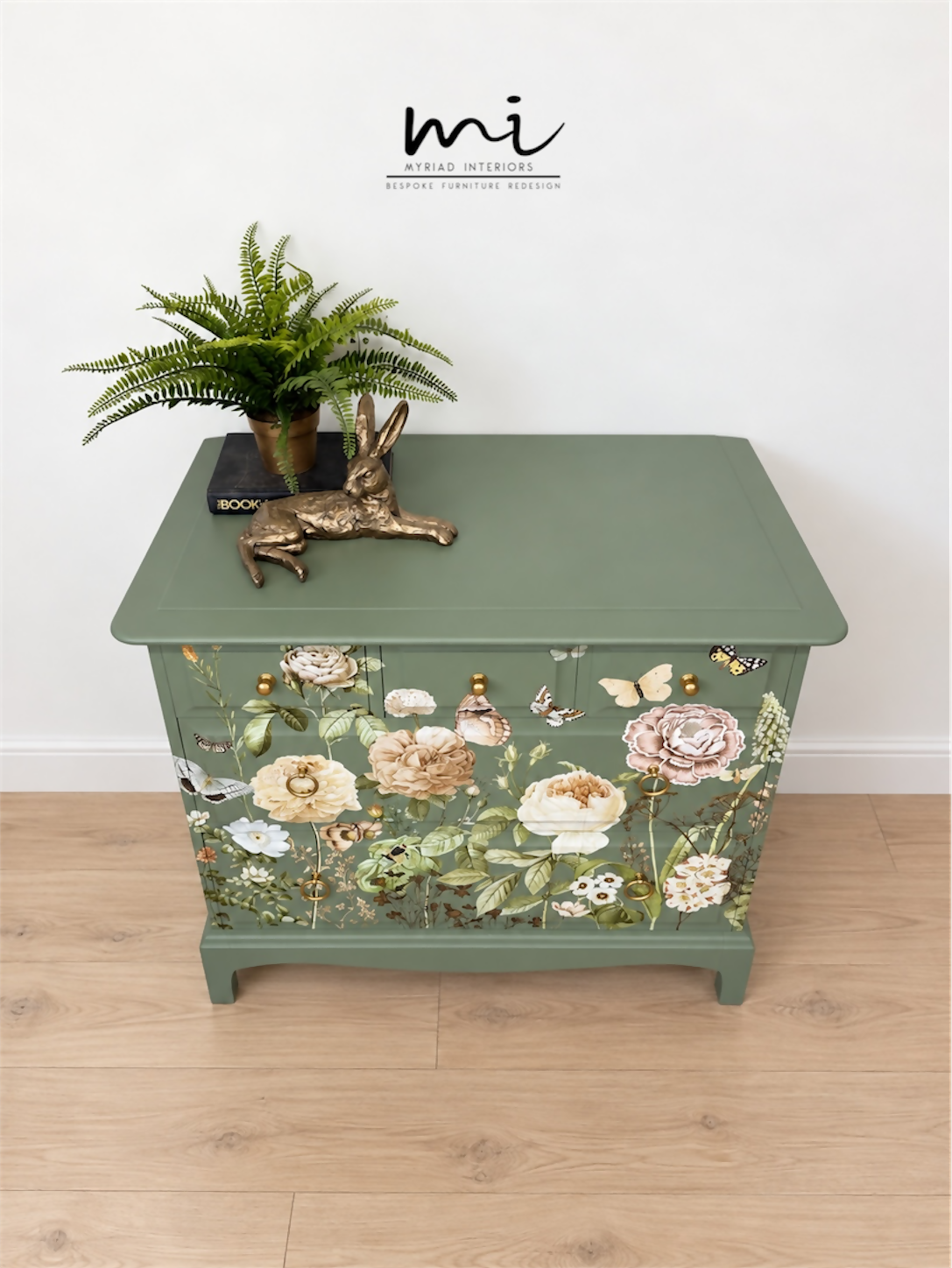 Sage green Stag Minstrel chest of drawers with neutral floral design. 3 over 2. Sideboard, dresser, bedside table