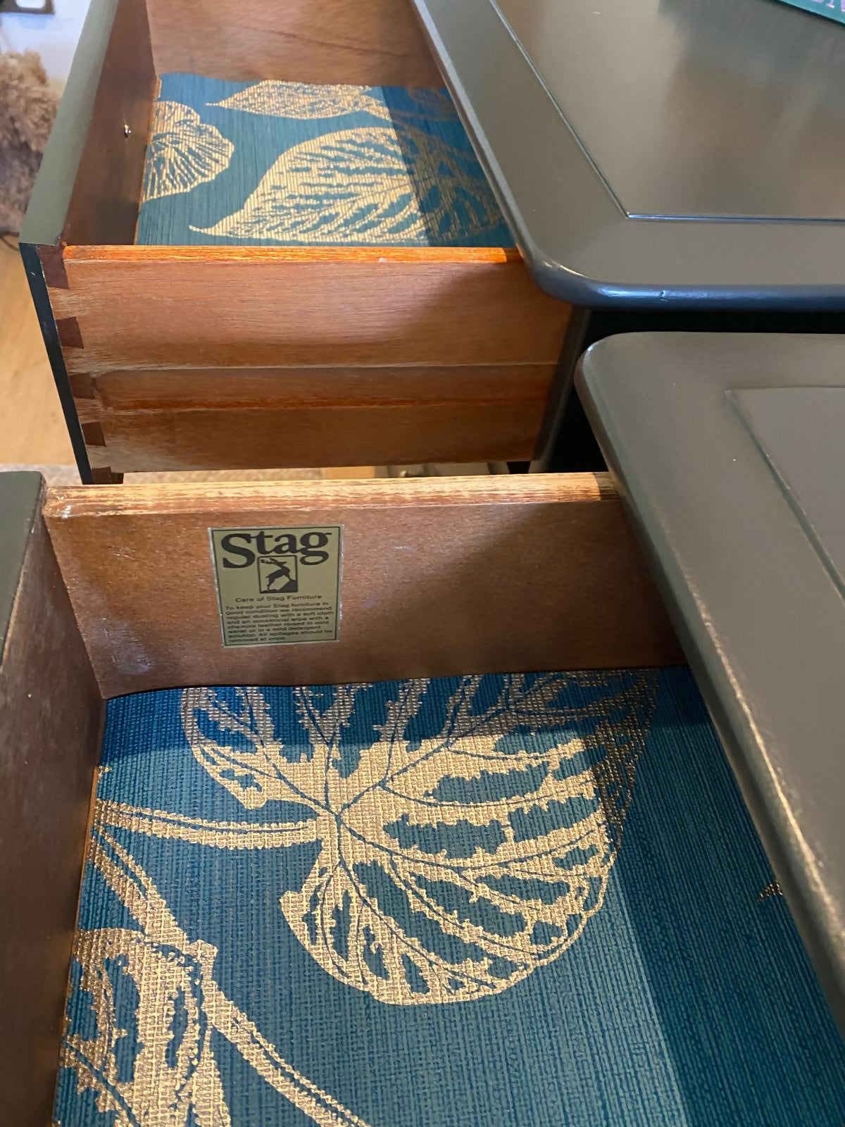 Stag four drawer black bedside cabinets, pair,