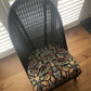 Lloyd loom low accent chair. Black satin paint and William morris style fabric