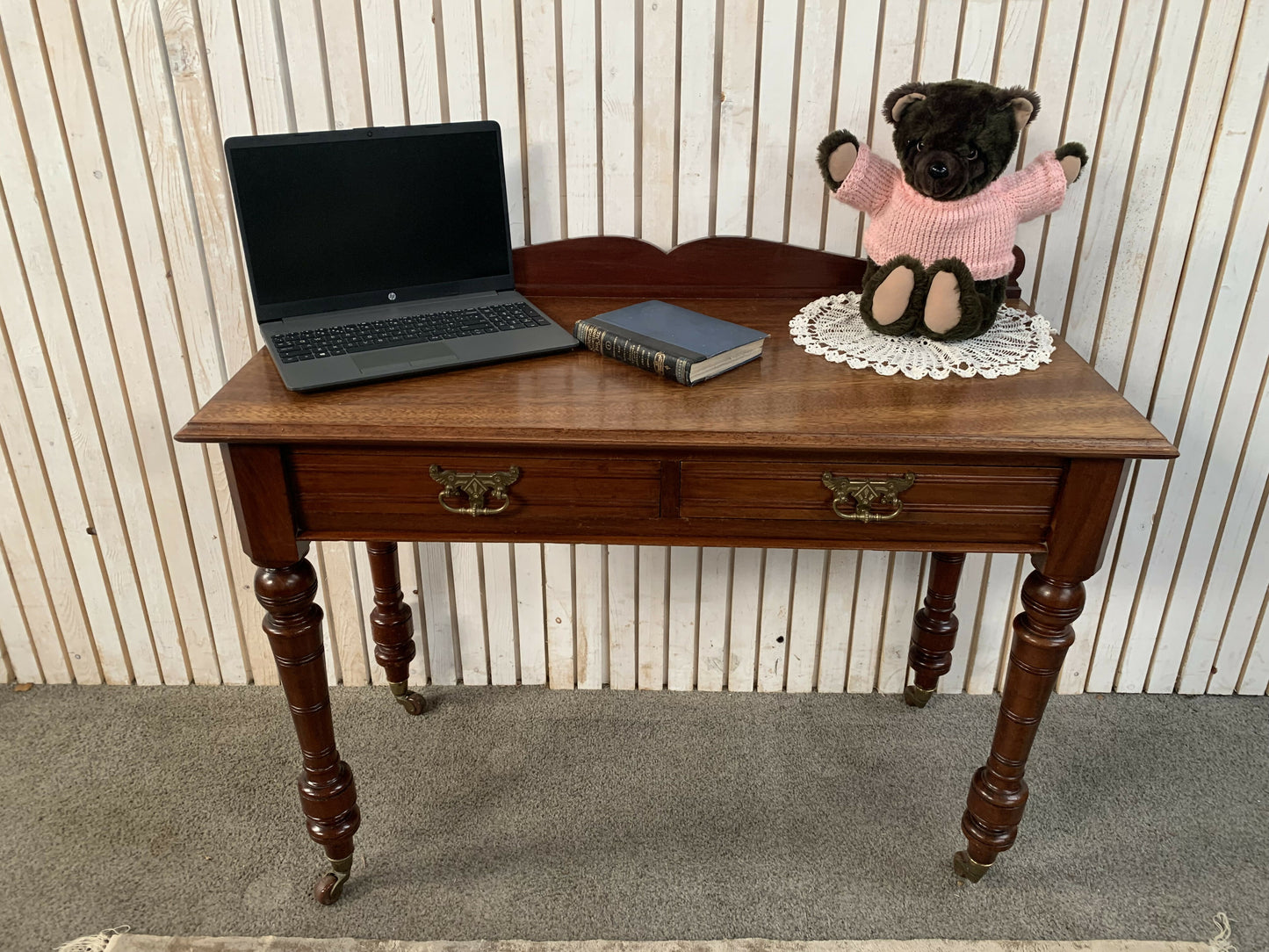 A Victorian Mahogany Writing Table/Desk With Drawer on castors.
