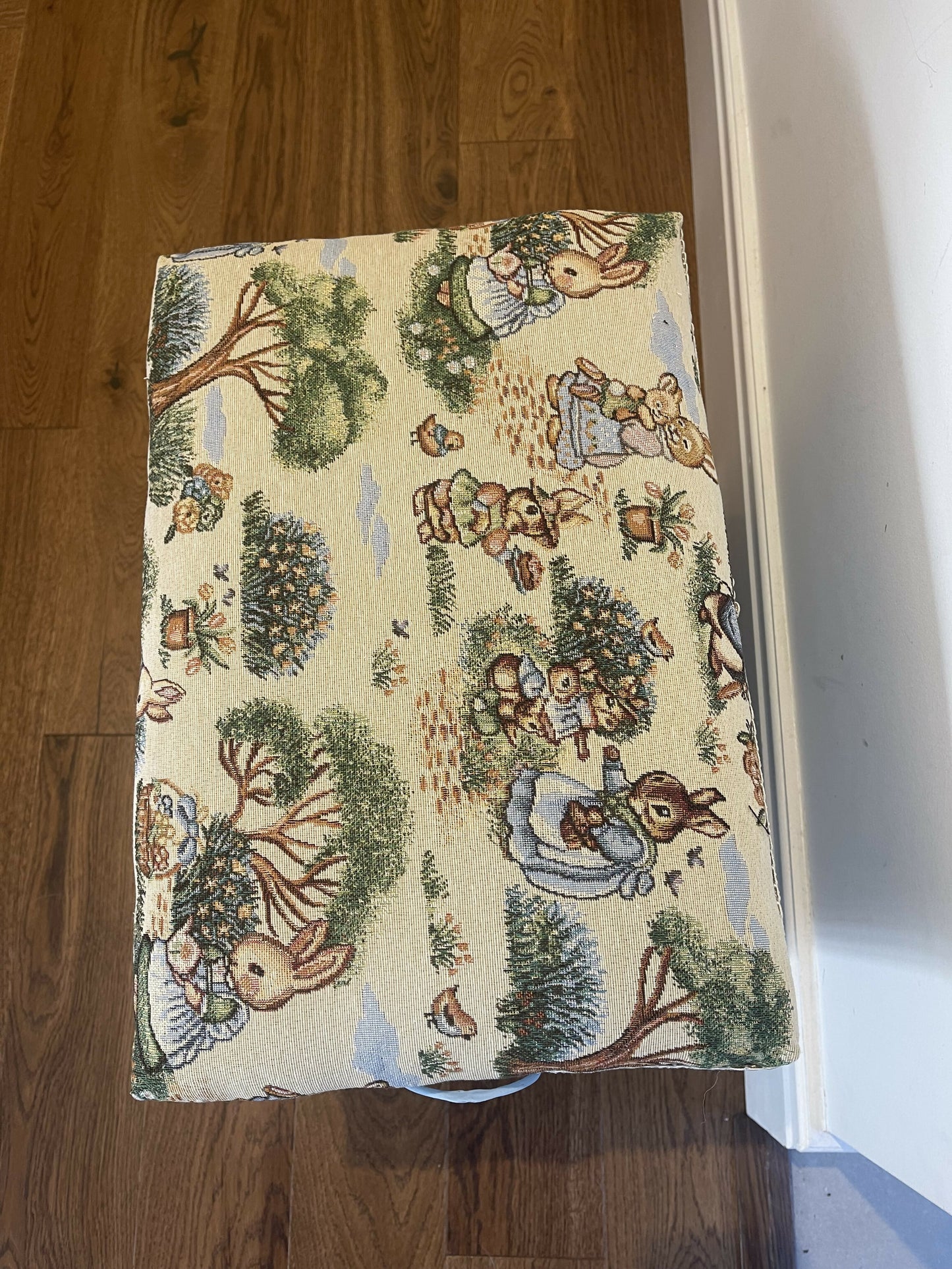 Bijou ottoman seat sky blue with Peter Rabbit themed upholstery. 45cm high 45cm long 30cm deep