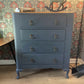 Vintage Harris Lebus 4 Drawer Chest With A Natural Wood Top And Brass Drop Handles.