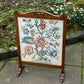 A RUPERT / NIGEL GRIFFITHS MONASTIC CARVED OAK FIRE SCREEN / STAND