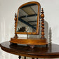 Victorian walnut dressing table mirror, supported on turned carved supports.0