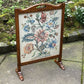 A RUPERT / NIGEL GRIFFITHS MONASTIC CARVED OAK FIRE SCREEN / STAND