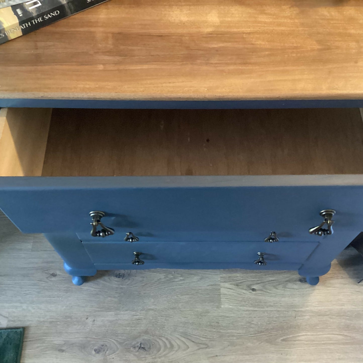 Vintage Harris Lebus 4 Drawer Chest With A Natural Wood Top And Brass Drop Handles.